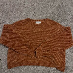 burnt orange colored sweater